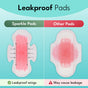 A comparison of two menstrual pads: Sparkle Maxi Pads with Wings (vegan, hypoallergenic) on the left with arrows highlighting leakproof wings, and another pad on the right showing visible leakage. Text notes Sparkle is leakproof; other pads may leak.