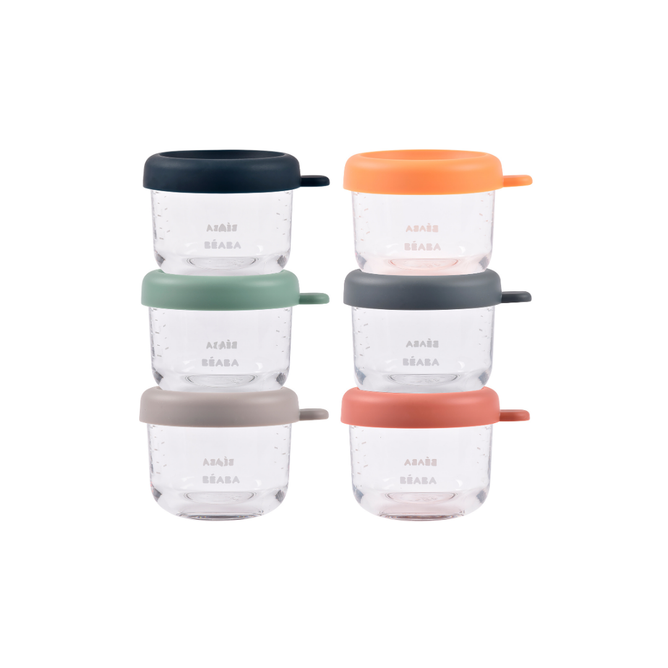 BEABA Glass Baby Food Jars-5oz, 6-Pack feature clear containers with airtight silicone lids in navy, orange, green, dark gray, light gray, and pink. Dishwasher safe and stackable—ideal for organized baby food storage.