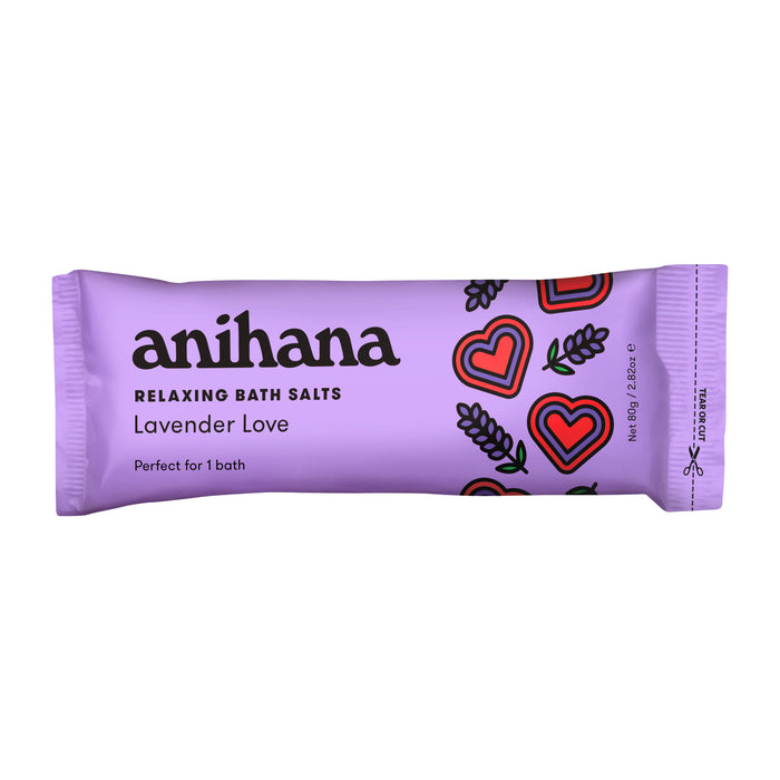Anihana Relaxing Bath Salts in a purple 55g packet labeled Lavender Love feature heart and lavender sprig designs. Infused with coconut oil, these lavender salts are perfect for one soothing bath.