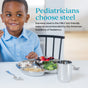 A young boy enjoys strawberries, rice, and chicken from the Ahimsa Mindful Mealtime Set. Text reads: “Pediatricians choose steel. Stainless steel is the ONLY kid-friendly material recommended by the American Academy of Pediatrics.”.
