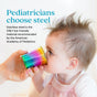 A baby with spiky hair drinks from an Ahimsa Starter Sips Cup. Text reads: Pediatricians choose steel. Non-toxic, stainless steel Starter Sips Cups are the only kid-friendly cups recommended by the American Academy of Pediatrics.