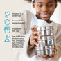 A smiling child holds Ahimsa’s The Large Circle—Stainless Steel Food Storage Container. Nearby, icons note: pediatrician-designed, fights bacterial growth, reusable, dishwasher-safe, and a non-toxic lunch box.