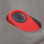 A close-up of a red car door lock/unlock switch on a gray surface—reminiscent of the secure seal on the Black + Blum Steel Food Bowl.
