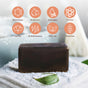 Marie Originals Itch Relief Soap sits on white powder with a green leaf, shown with icons for no phthalates, petroleum, parabens, SLS, dyes, artificial scents, GMOs, or gluten—ideal for sensitive skin cleansing.