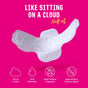 A pack of FLO Organic Bamboo Period Pads Megapack by Here We Flo sits on a pink background with text: Soft as a cloud. Ultra absorbent. No fragrance. No chlorine bleach. Icons highlight comfort and eco-friendly features.