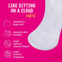 A close-up of a Flo Organic Bamboo Panty Liner by Here We Flo on a pink background with text: LIKE SITTING ON A CLOUD. Ultra-soft, absorbent, sensitive skin friendly, no chlorine bleach or fragrance. Icons show each feature.