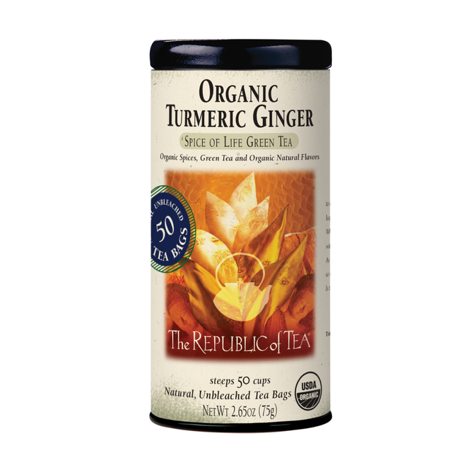 A cylindrical tin of The Republic of Tea’s Organic Turmeric Ginger Green Tea contains 50 unbleached tea bags. The label features turmeric, ginger, and green tea leaves, with USDA Organic and Spice of Life Green Tea branding.