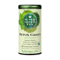 A cylindrical tin of Organic SuperGreen Detox Green Tea by The Republic of Tea features images of green apple, mint, and tea leaves. The label highlights a green tea blend with Japanese matcha, chlorella, and USDA organic certification.
