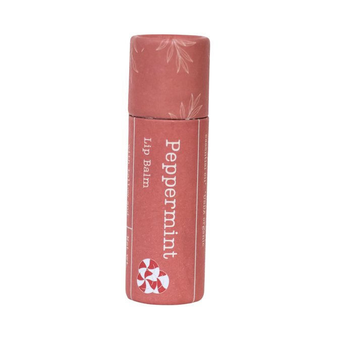 A pink cylindrical tube of Hearth and Homestead’s Tallow Lip Balm, labeled “Peppermint” and featuring a peppermint candy illustration with a leaf pattern on the cap, enriched with nourishing tallow and cocoa butter, isolated on a white background.