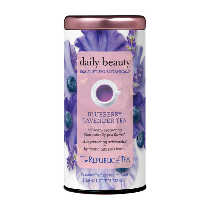 A canister of Daily Beauty Tea by The Republic of Tea, adorned with purple flowers and blueberries, labeled as a beauty herbal supplement and containing 36 naturally flavored tea bags.