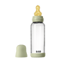 The BIBS Glass Baby Bottle with Natural Rubber Nipple Complete Set (0+ Months) features a clear glass bottle with green cap and base, a heart-shaped yellow nipple, anti-colic design, and the green cover sits beside the labeled bottle.