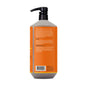 A large orange bottle of Alaffia EveryDay Shea Body Wash with a black pump dispenser is pictured against a white background. The back label displays product directions, ingredients—including fair trade shea butter—and a barcode. Specially formulated for sensitive skin, this body wash is unscented.