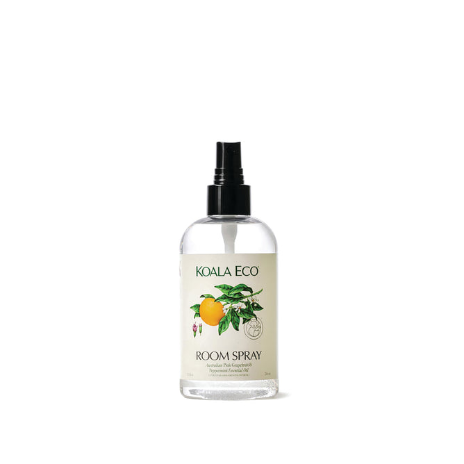 Koala Eco Room Spray in a clear bottle with black pump, featuring a white label with lemon and green leaf illustrations that evoke an Australian bush scent, plus product and brand details.
