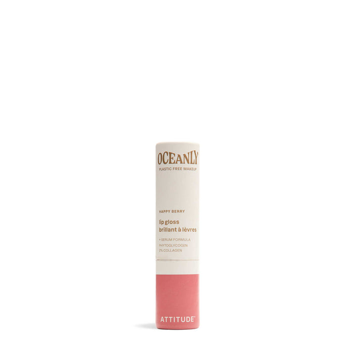A tube of ATTITUDE Oceanly Lip Gloss in shade Happy Berry, designed in light beige and pink, is made with naturally sourced ingredients and is vegan and cruelty-free.