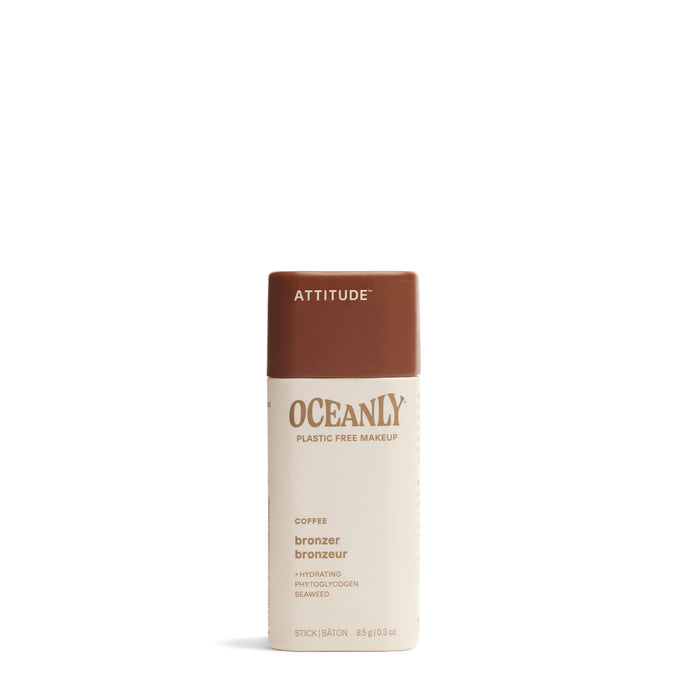 A cylindrical stick of ATTITUDE Oceanly Bronzer in the shade Coffee features a brown cap and beige body, standing upright on a white background.