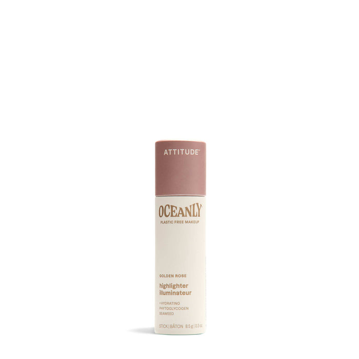 ATTITUDE Oceanly Highlighter stands upright on a white background—a plastic-free, hydrating makeup stick made with naturally sourced ingredients, beige body, and dusty pink cap.