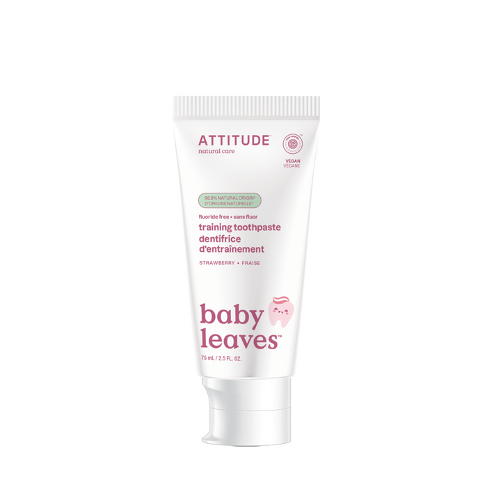 A 75 ml (2.5 fl oz) white tube of ATTITUDE baby leaves Training Toothpaste, strawberry flavor, is fluoride-free, vegan, EWG VERIFIED®, with pink and green text and a pink smiley face icon.