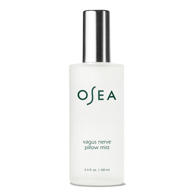 A frosted glass spray bottle with a silver cap labeled OSEA Vagus Nerve Pillow Mist holds 3.4 fl oz (100 ml) and is designed to promote relaxation before sleep.