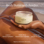 A person applies OSEA Undaria Algae™ Body Butter to their leg from an open jar. Text highlights 72-hour hydration, firmer, smoother skin, and reduced crepiness—all in a beach setting.