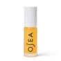 A small frosted glass bottle with yellow liquid, a white cap, and “OSEA” printed vertically in black holds the brand’s Hyaluronic Lip Oil Booster.
