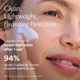 A woman smiles while applying white cream to her cheek. Text: “Clean, lightweight hydration and SPF 50 protection. OSEA Marine Screen Mineral Sunscreen with non-nano zinc oxide boosts hydration—94% said it glides on smoothly and applies evenly.”.