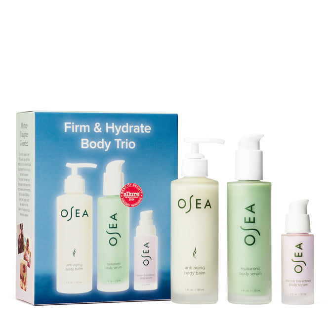 The OSEA Firm & Hydrate Body Trio includes an anti-aging balm, hydrating body serum, and ocean botanical serum, all presented in front of a blue box featuring product images and descriptions.