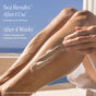 A person applies Undaria Algae™ Body Butter Bergamot & Vanilla Bean by OSEA to their leg with an ocean backdrop. Text: Sea Results. 1 Use: Firming hydration up to 72h. 4 Weeks: Improves skin crepiness & firmness.