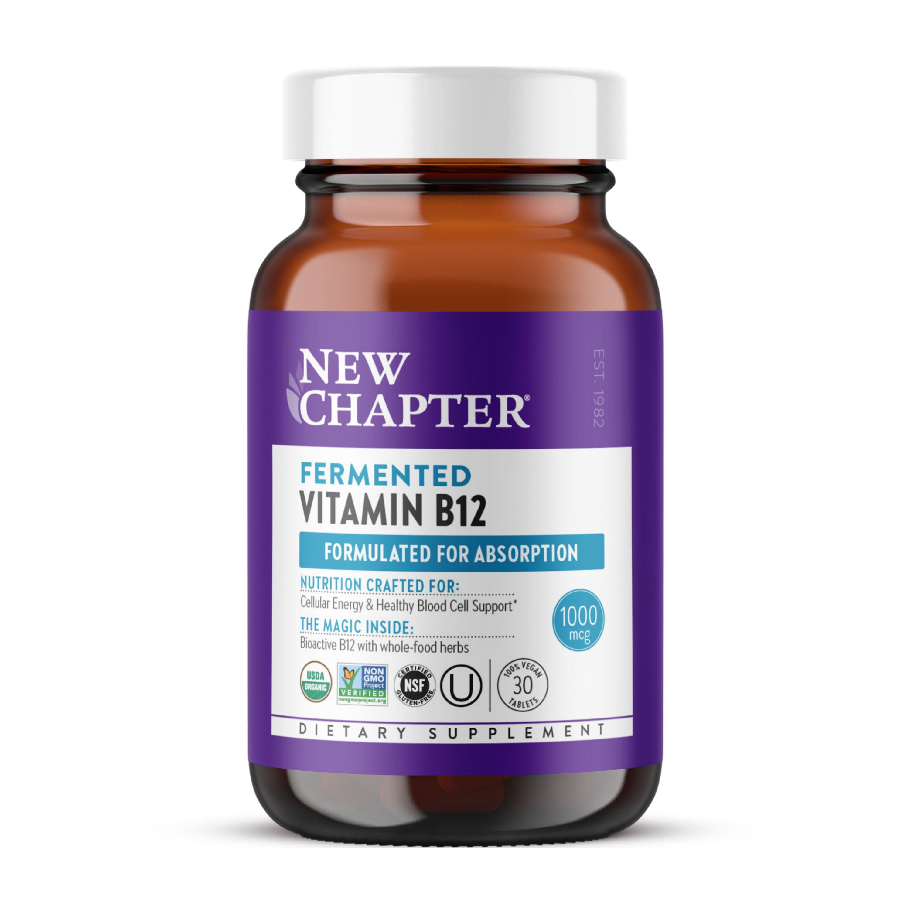 A brown glass bottle labeled New Chapter Fermented Vitamin B12 - For Cellular Energy + Healthy Blood Cells contains 1000 mcg vegan B12, designed for absorption and cellular energy, with a white cap and purple-blue-white label.
