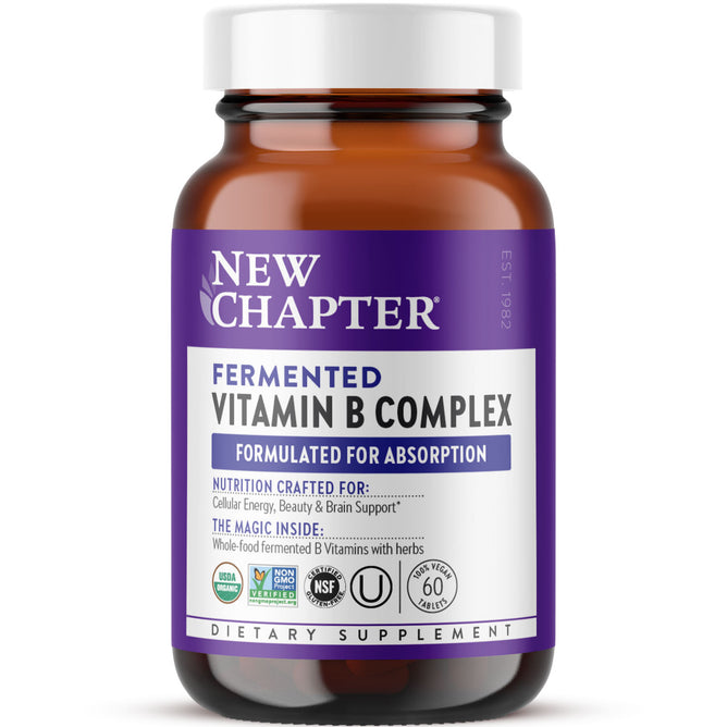 A brown bottle of New Chapter Fermented Vitamin B Complex with a white and purple label, certifications, and a white cap. This energy-supporting dietary supplement features fermented B vitamins.