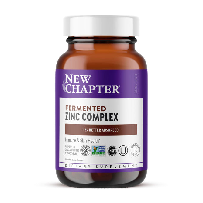 A brown glass bottle labeled New Chapter Fermented Zinc Complex dietary supplement claims immune and skin support, 1.6x better absorbed fermented zinc, plus certification logos, shown on a white background.