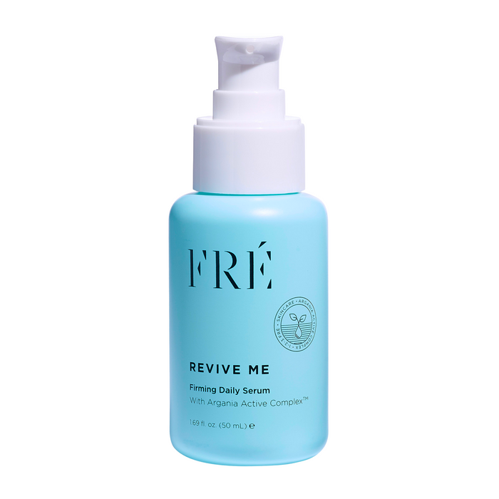 A 50 mL light blue bottle of FRÉ Skincare REVIVE ME Firming Daily Serum with a white pump dispenser. This facial serum features an antioxidant complex to revitalize your skin daily.