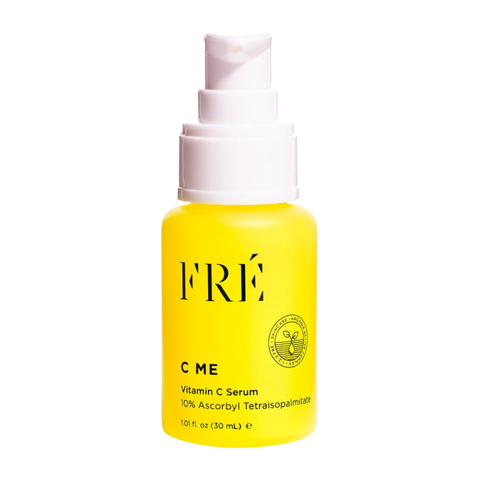 A yellow bottle with a white pump labeled FRÉ Skincare C ME 10% Vitamin C Serum, 1.01 fl oz (30 mL), formulated to reduce dark spots and brighten skin, is displayed against a white background.