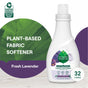 A bottle of Seventh Generation Liquid Fabric Softener, Fresh Lavender scent, labeled plant-based and non-toxic, rests on a light surface. Visible are the green Safer Choice logo and a badge noting 32 loads.