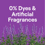 Display 0% Dyes & Artificial Fragrances on a purple backdrop, showcasing Seventh Generations hypoallergenic Concentrated Laundry Detergent above tall, purple flowering plants.