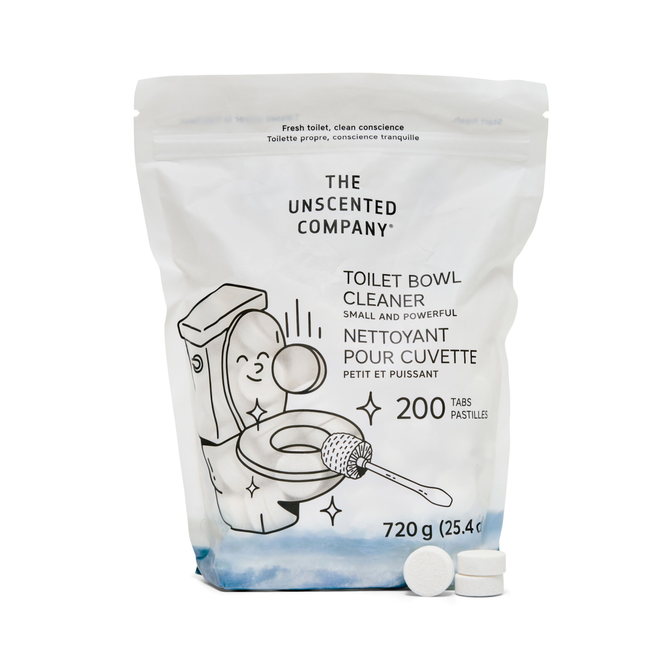 A white resealable bag of The Unscented Company Toilet Bowl Cleaning Tabs features an illustrated toilet, brush, and bubbles. The bilingual package contains 200 tablets; two tabs are displayed in front. Promotes sustainable hygiene.