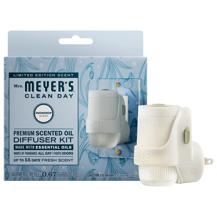 Mrs. Meyer’s Premium Scented Oil Diffuser Kit featuring one warmer and one refill, packaged in a light blue floral box labeled Snowdrop garden-inspired scent.
