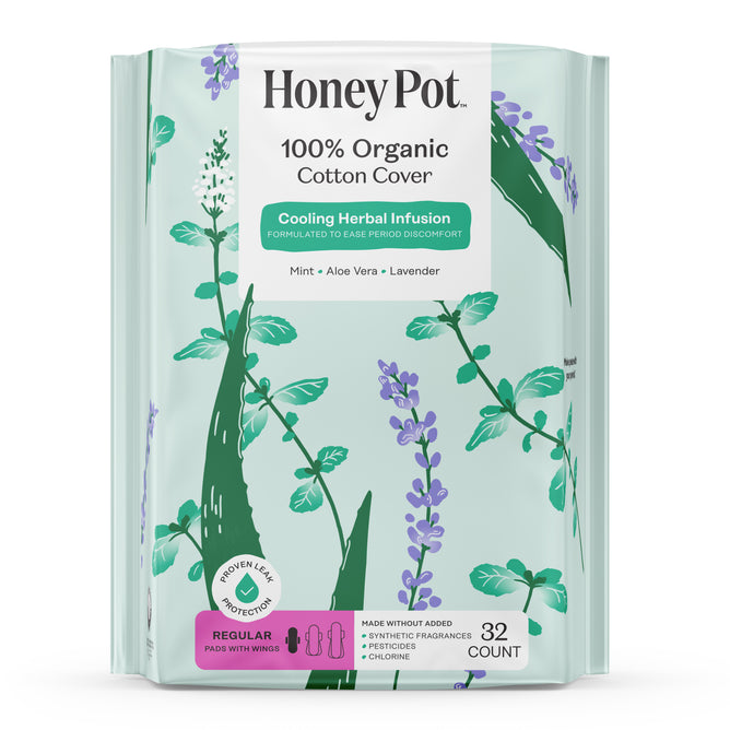 A pack of HoneyPot Menstrual Pads - Herbal-Infused 100% Organic Cotton Cover, featuring a floral design and a label highlighting the cooling herbal infusion of mint, aloe vera, and lavender. This package includes 32 regular pads with wings for comfort and freshness.
