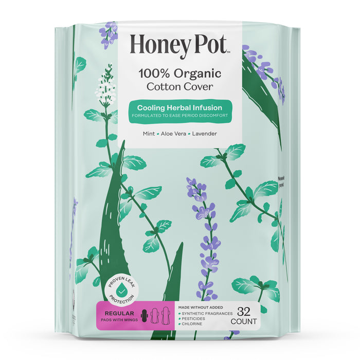 A pack of HoneyPot Menstrual Pads - Herbal-Infused 100% Organic Cotton Cover, featuring a floral design and a label highlighting the cooling herbal infusion of mint, aloe vera, and lavender. This package includes 32 regular pads with wings for comfort and freshness.