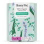 A pack of HoneyPot Menstrual Pads - Herbal-Infused 100% Organic Cotton Cover, featuring a floral design and a label highlighting the cooling herbal infusion of mint, aloe vera, and lavender. This package includes 32 regular pads with wings for comfort and freshness.