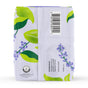 A white package with a green and purple leaf and berry design. The back features a barcode, organic cotton certification, distributor info, calming herbal infusion details, Made in China text, and The Honeypot Companys branding.
