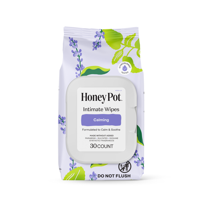 A package of HoneyPot Calming Intimate Wipes - Herbal Infusion, designed to gently soothe and care for intimate skin, containing 30 wipes. The packaging is adorned with purple flowers and green leaves, highlighting its herbal intimate care formula, and includes a “Do Not Flush” icon at the bottom.