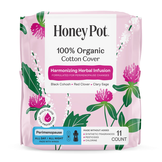A pink floral package of HoneyPot Peri-menopause All Day/All Night Pads - Harmonizing Herbal Infusion contains 11 organic cotton pads with wings, specially designed to support hormone balance during perimenopause.