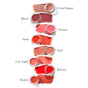 Seven open RMS Beauty Lip2cheek pots with moisturizing color swatches are arranged vertically. Shades, from top to bottom, are: Crystal Slipper, Illusive, Demure, Smile, Spell, Lost Angel, Beloved, and Modest—each labeled beside the swatch.