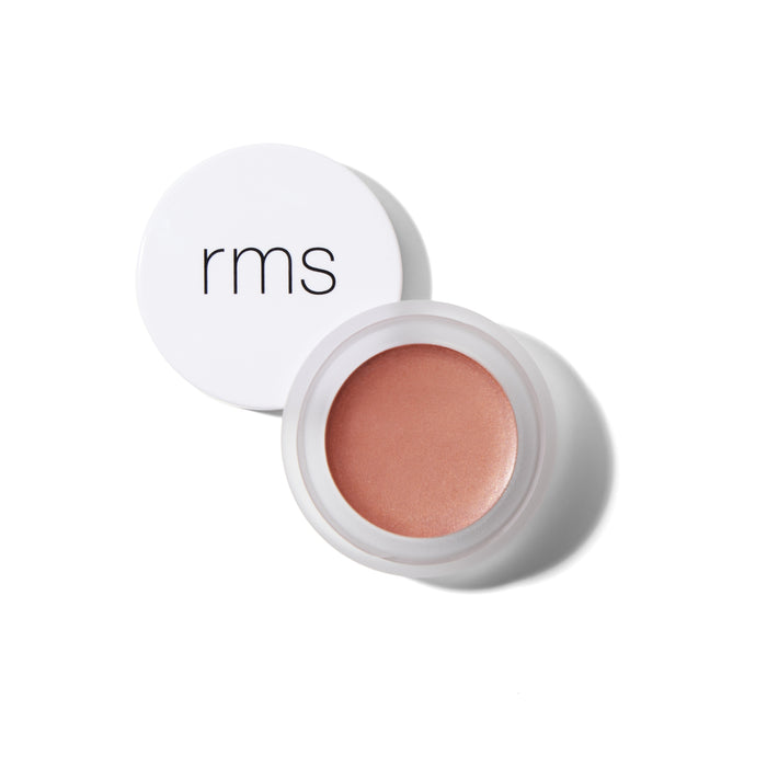 A small round pot of RMS Beauty Lip2cheek, a peach cream makeup with hydrating ingredients and a white lid labeled rms, shown on a white background.