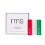 A white box labeled RMS Beauty The Mini Lip Oil Trio, a limited-edition holiday set, is shown next to three nourishing lip oils in pink, clear, and green with RMS printed vertically on each bottle.