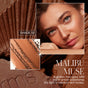 A woman with light to medium skin wears RMS Beautys ReDimension Hydra Bronzer. Close-ups show the golden brown, talc-free powder in a refillable compact. Text: “Malibu Muse—A golden hour glow with warm amber undertones.”.