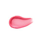 A smear of RMS Beauty’s Legendary Lip Oil—a glossy pink, hydrating formula enriched with organic jojoba oil—is shown on a white background.