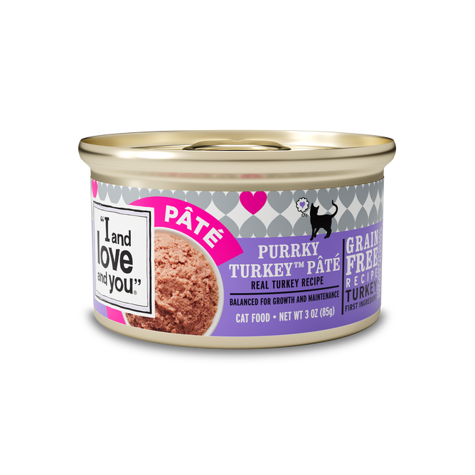 A 3 oz can from I and Love and Yous Purrky Turkey Pate Grain-Free Canned Cat Food, Case of 24 features a purple and gray label with heart shapes, emphasizing its grain-free formula with real turkey for healthy digestion.