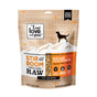 A brown and beige bag of I and Love and Yous Stir and Boom Raw Raw Chick Boom Ba Grain-Free Dehydrated Dog Food features a mountain design with a dog silhouette. This chicken flavor blend includes herbs, veggies, and fruit—ideal for your pups diet.