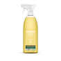 A clear spray bottle of method All Purpose Cleaner, lemon + freesia scent, holds yellow liquid. The label notes natural cleaning power for a streak-free finish and that it cuts grease and grime without parabens.